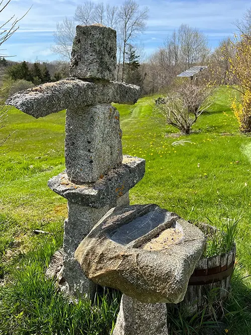 Stone sculpture and stone bird bath and bird feeder