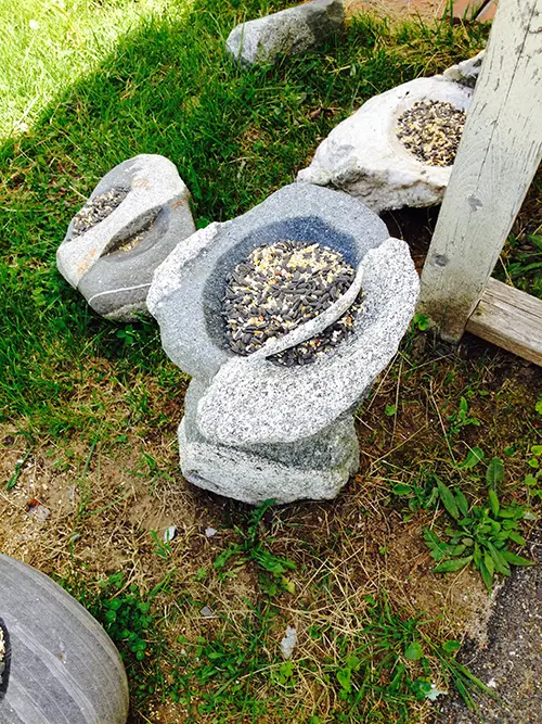 Divided stone feeder sculpture